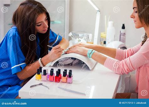 Woman Hand On Manicure Treatment In Beauty Salon Beauty Parlour Stock