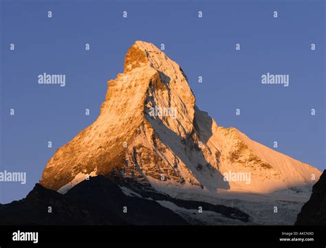 Peak Of Matterhorn Mountain Glowing At Sunrise In First Light Of Dawn