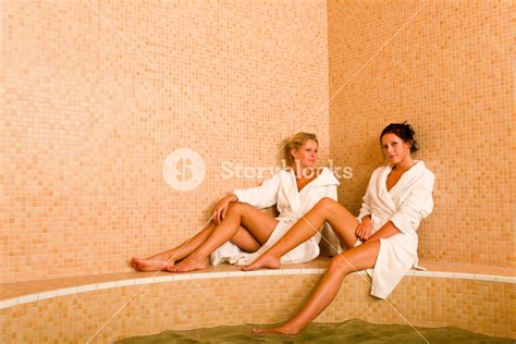 Relax Bath Spa Two Beautiful Women Bathrobe Sitting Water Jacuzzi Royalty Free Stock Image