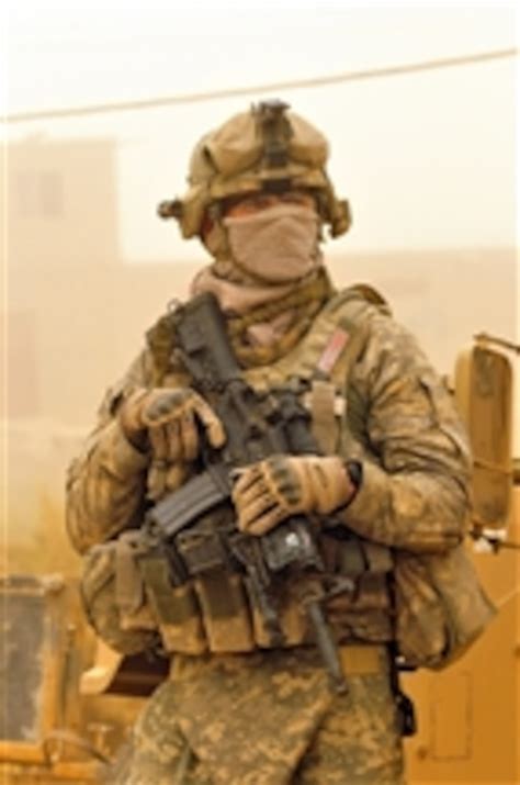 A Us Army Soldier Wears A Mask To Protect Himself From A Dust Storm
