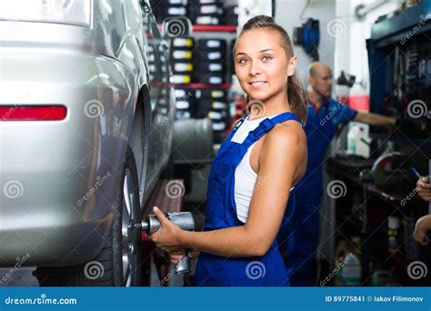 Female Mechanic Working On Car Tyre Service Stock Image Image Of