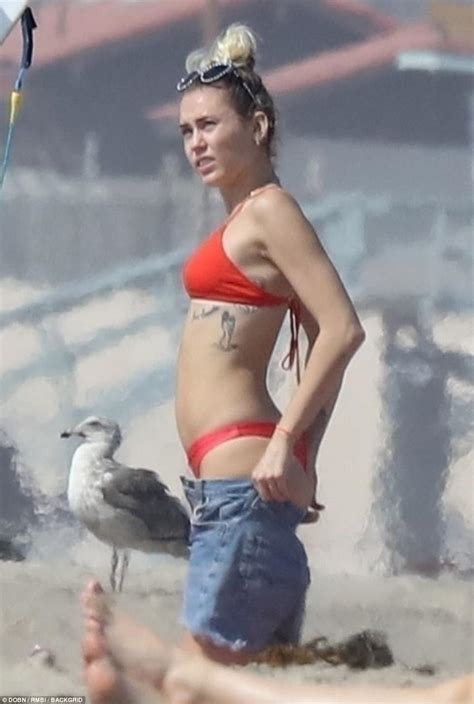 Bikini Clad Miley Cyrus Hits The Beach With Liam Hemsworth Daily Mail Online