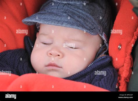 Four Months Old Baby Sleeping In His Pram Stock Photo Alamy