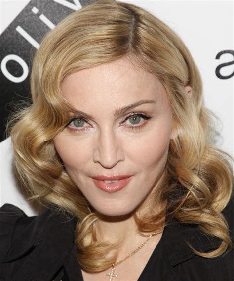 Check out some pictures below. Madonna Medium Wavy Formal Hairstyle