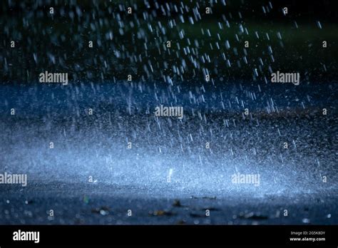 Night Rain Drops Fall On The Wet Cold Asphalt Stock Photo Alamy