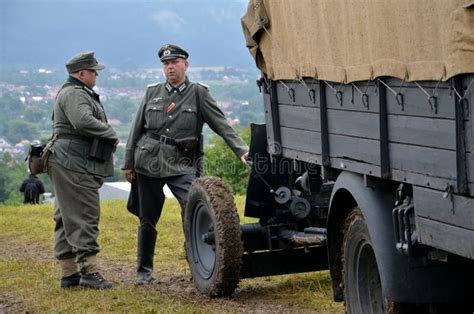 Historic Truck With Two Men Dressed In German Nazi Uniforms During Historical Reenactment Of