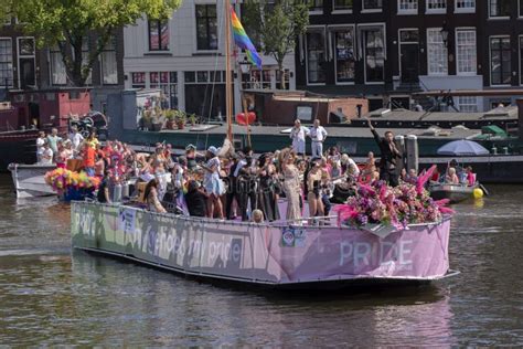 pride amsterdam ambassadeurs boat at the gaypride canal parade with boats at amsterdam the