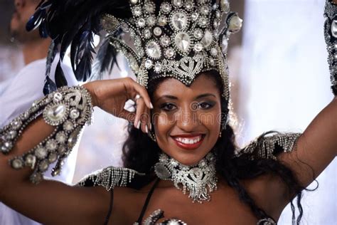 glamourous dancing queen portrait of a beautiful samba dancer performing in a carnival with her