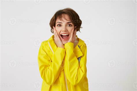 Portrait Of Young Happy Amazed Cute Short Haired Girl Wears In Yellow
