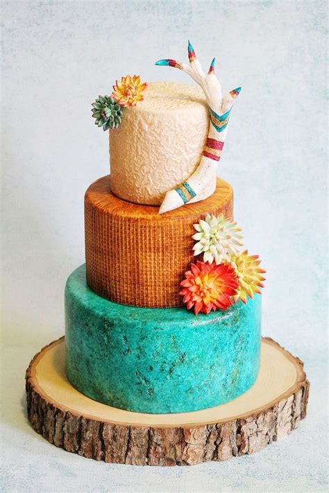 South Western Wedding Cake Bottom Is Turquoise Stone Middle Is Burlap Cloth And Top Is Sand