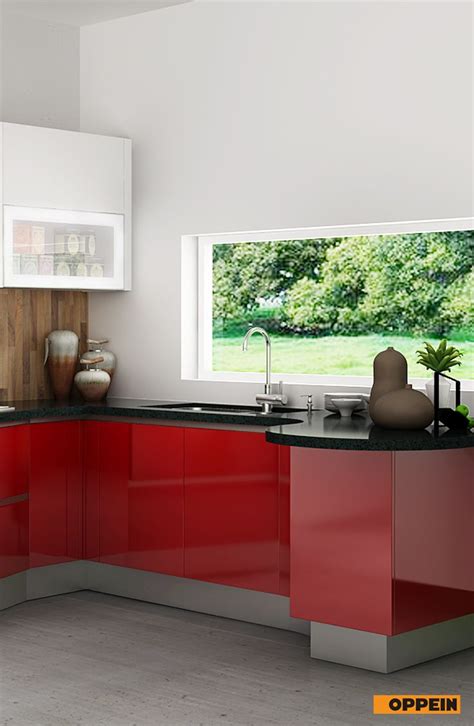 A Modern Kitchen With Red And White Cabinets