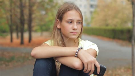 Sad Girl Depressed Cute Teen Female Sitting Deep In Thought With Head
