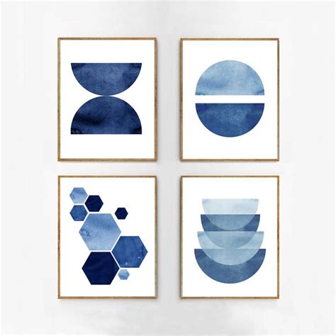 Three Blue And White Art Prints Hanging On A Wall