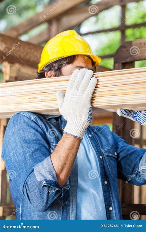 Worker Carrying Wooden Planks At Site Stock Image Image Of Person
