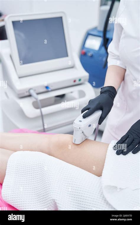 Woman Having Ultrasound Lifting Procedure In Beauty Center Stock Photo