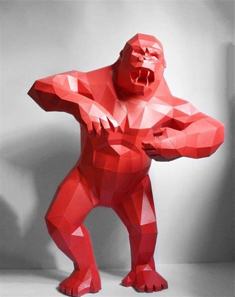 An Origami Gorilla Standing In Front Of A White Wall