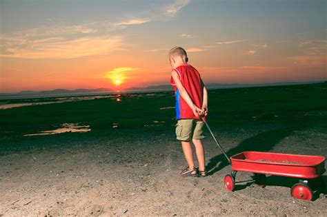 Boy At Sunset Red Wheelbarrow Repenting Stock Photo Download Image