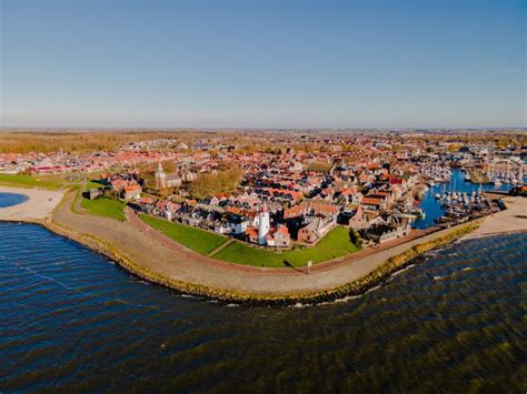 Urk Lighthouse With Old Harbor During Sunset Urk Is A Small Village By