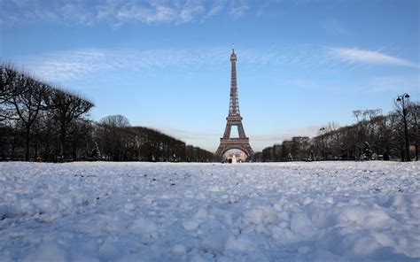 Snow And Freezing Rain In Paris Forces The Eiffel Tower To