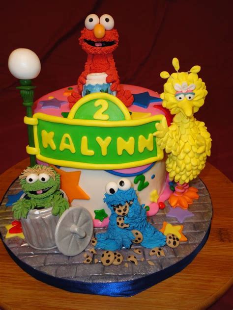 A Birthday Cake With Sesame Street Characters On It