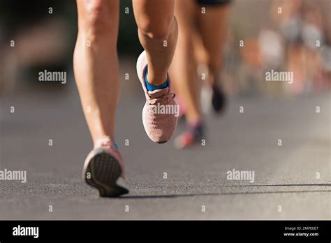 Athlete Runner Feet Running On Road Close Up On Shoe Marathon Running