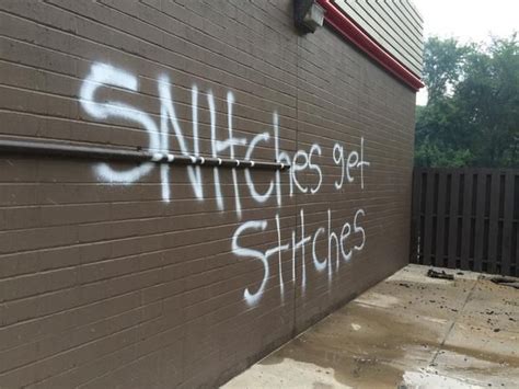 “snitches Get Stitches” Message Spray Painted On Burned Out Quiktrip