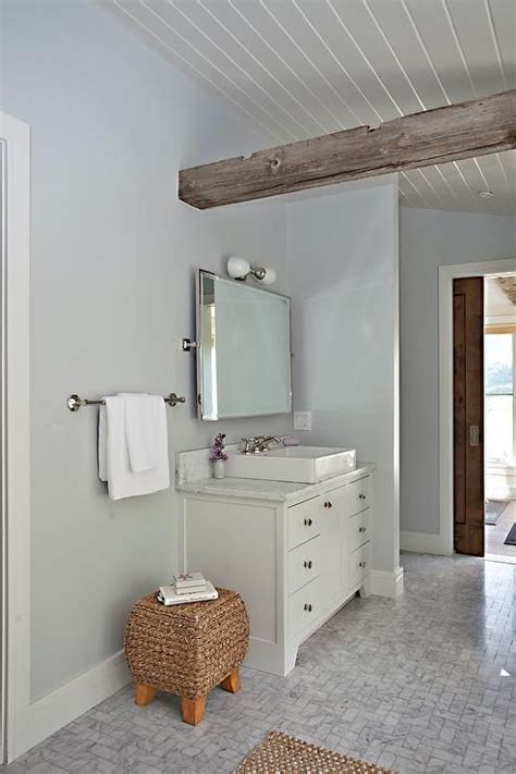 Master Bathroom Designed With A Rustic Wooden Ceiling Beam On A Plank