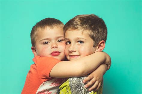 Portrait Of Two Children Hugging Each Other Stock Photo Image Of Male