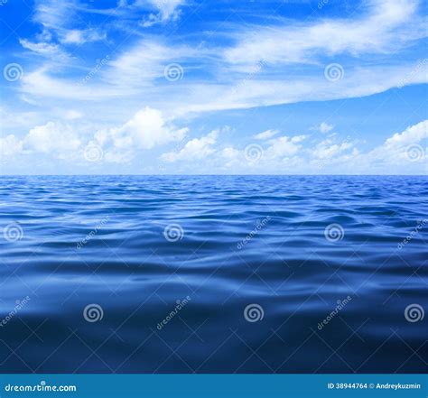 Sea Or Ocean Water With Blue Sky And Clouds Stock Photo Image Of Wave