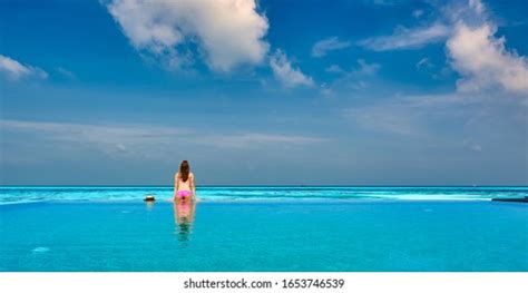 Woman Relaxing Infinity Swimming Pool Maldives Stock Photo 1653746539