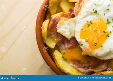 Fried Eggs With Chips And Serrano Ham Traditional Spanish Tapa