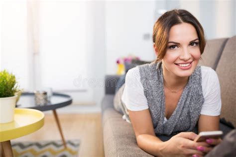 Happy Woman Lying On Couch And Using Mobile Stock Photo Image Of Cell