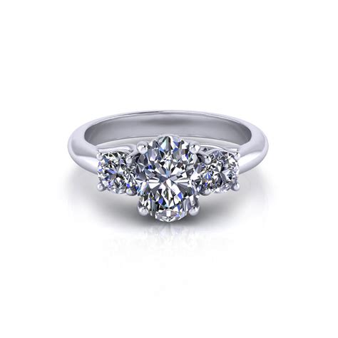 Design your own engagement ring center diamond the center stone in this ring is a round brilliant cut diamond that's framed perfectly by the platinum double prongs holding it in place. Oval 3 Stone Engagement Ring - Jewelry Designs