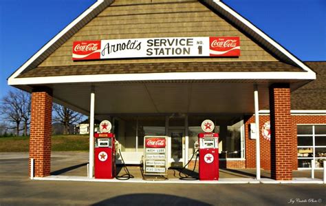 Vintage Brick Gas Station With Coca Cola Signs And Texaco Gas Pumps