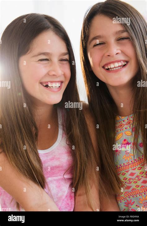 Caucasian Twin Sisters Smiling Stock Photo Alamy