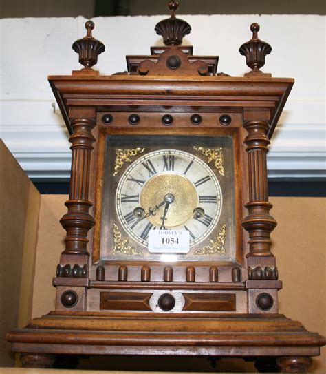 A Late 19th Century Walnut Cased Mantel Clock With Fourteen Day