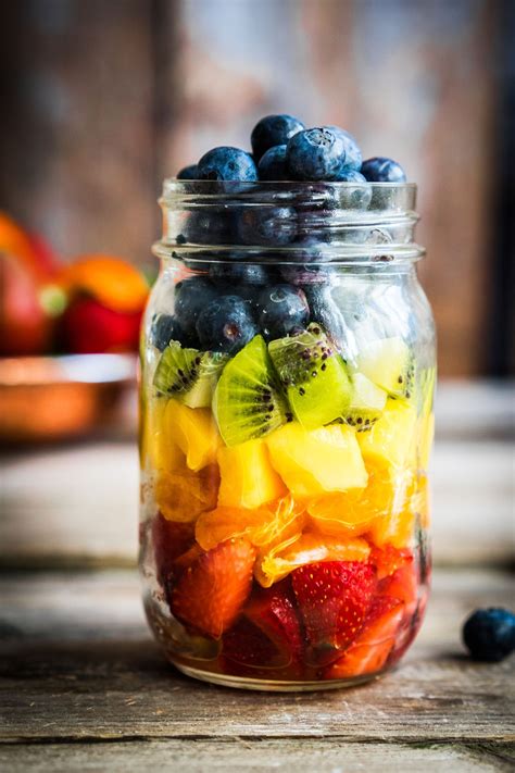 Colourful Fruit Salad On A Jar With Strawberry Orange Pineapple Kiwi