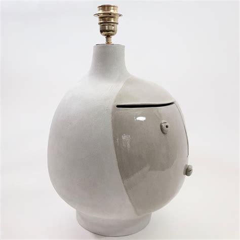 Concept gravity grey marble/white was designed with the contrast between the heavy cylindrical when the lamp is on, it emits a diffuse and atmospheric glow that contributes to the cosy atmosphere. Dalo, Large Grey Ceramic Table Lamp Base For Sale at 1stdibs