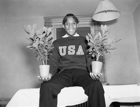 Us Olympian Jesse Owens Holding Two Oak Saplings At The 1936 Berlin