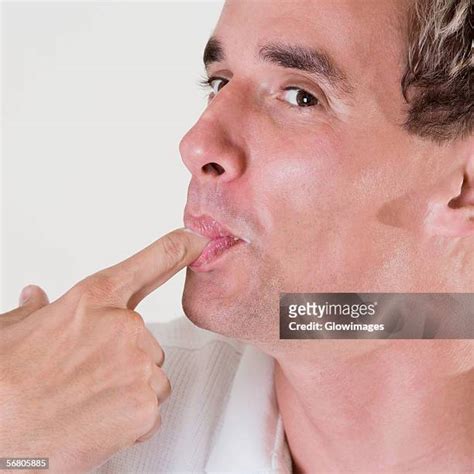 Guy Licking Finger Photos And Premium High Res Pictures Getty Images