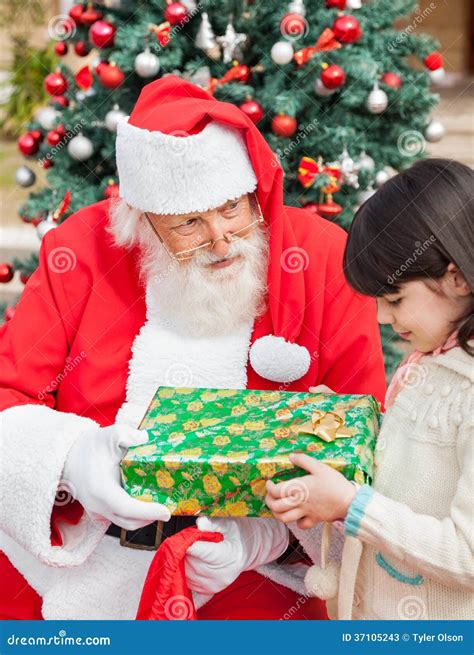 Santa Claus Giving T To Girl Stock Image Image Of Elementary Noel