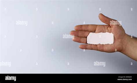 Small White Piece Of Paper In His Hand Man Stock Photo Alamy