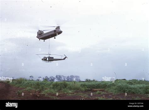 Chinook Helicopter Carrying Uh 1h Huey Of Bravo Troop 1st Squadron