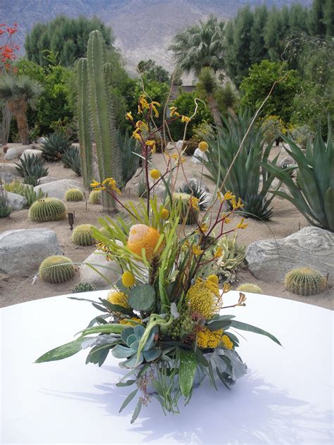 Past the industrial beauty of the turbine wind farms, and pressed up against the stark face of the san jacinto mountains, palm springs is the definition of a desert oasis, a modern design. Palm Springs desert table design. | Flower arrangements ...