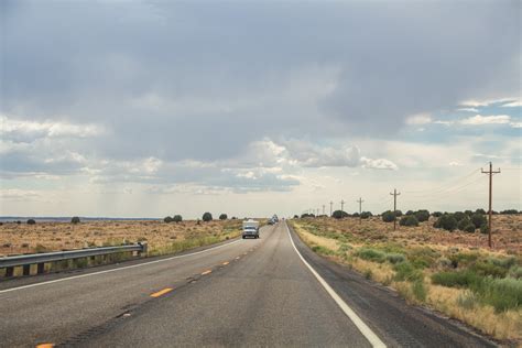 Free Stock Photo Of Vehicles In Two Lane Desert Road