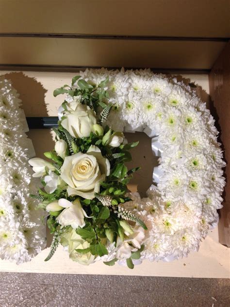 When placing an order for funeral flowers please inform us of the name of the deceased and the name of the funeral directors. White Based funeral letter D with white ribbon edge and ...