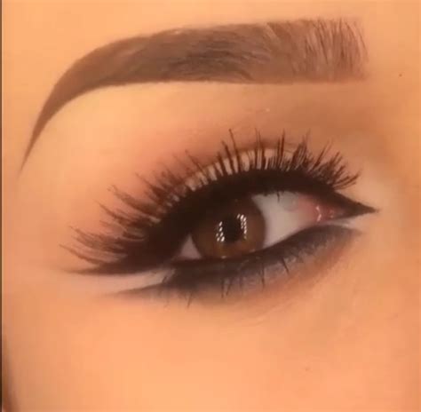 Thick Black Top Eyeliner Into A Wing With White Underneath And Black