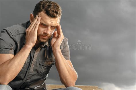Depressed Handsome Bearded Man Touching Having A Headache Stock Image