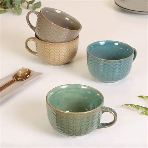 We have 3 in stock. set of four large coffee mugs by dibor ...