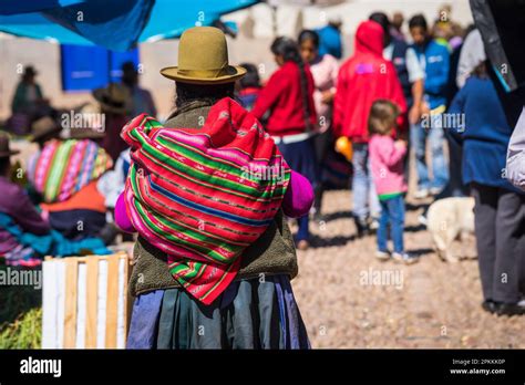 Peruvian Woman Carrying Colorful Bag On Her Back Pisaq Market Sacred